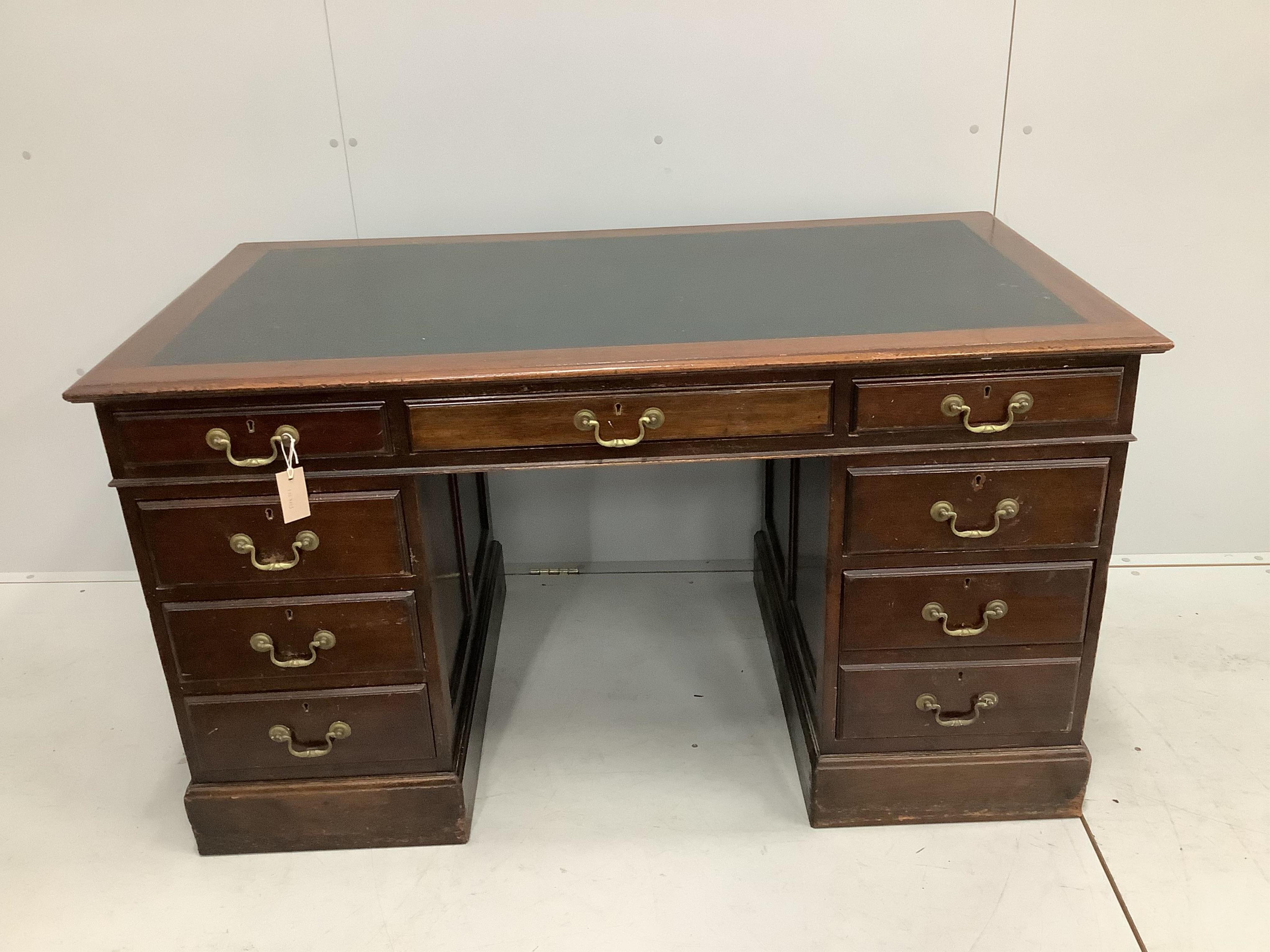 An Edwardian mahogany pedestal desk, width 137cm, depth 76cm, height 77cm. Condition - fair